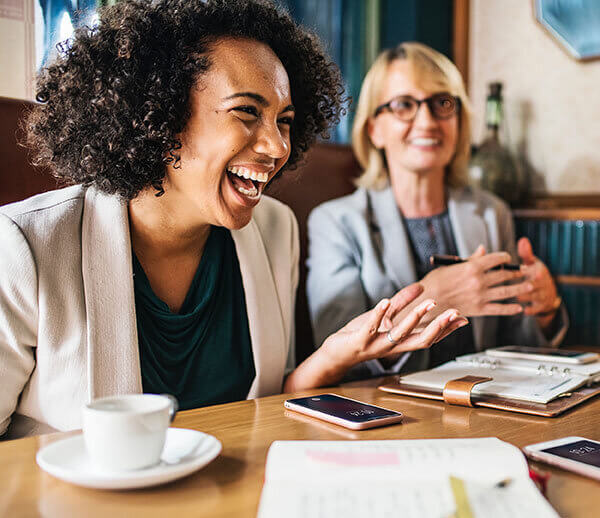 african-businesswoman-laughing-in-meeting african-businesswoman-laughing-in-meeting